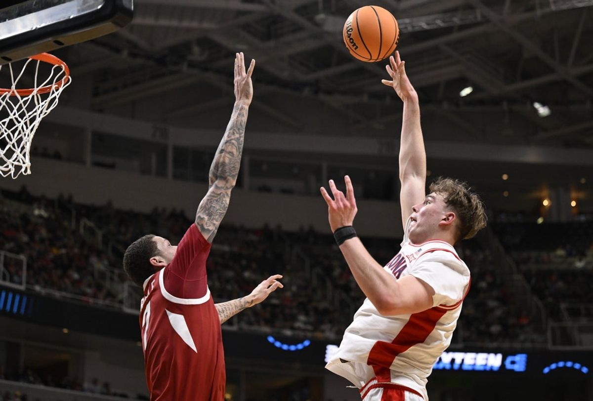 Mar 26, 2026; San Jose, CA, USA; Arizona Wildcats center Motiejus Krivas (13) shoots over Arkansas Razorbacks forward Trevon Brazile (7) in the first half during a Sweet Sixteen game of the West Regional of the men's 2026 NCAA Tournament at SAP Center. Mandatory Credit: Eakin Howard-Imagn Images
