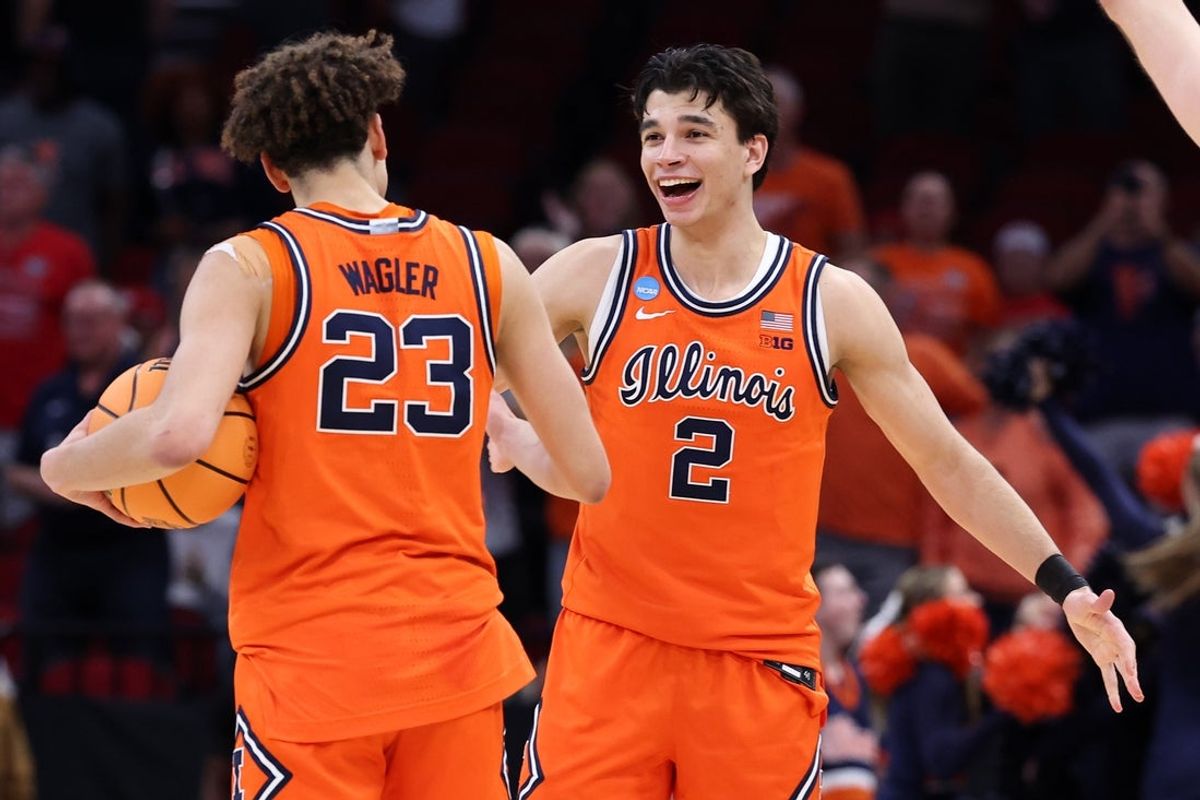 Mar 26, 2026; Houston, TX, USA; Illinois Fighting Illini guard Keaton Wagler (23) and guard Andrej Stojakovic (2) reacts after the game in a Sweet Sixteen game of the South Regional of the men's 2026 NCAA Tournament at Toyota Center. Mandatory Credit: Troy Taormina-Imagn Images