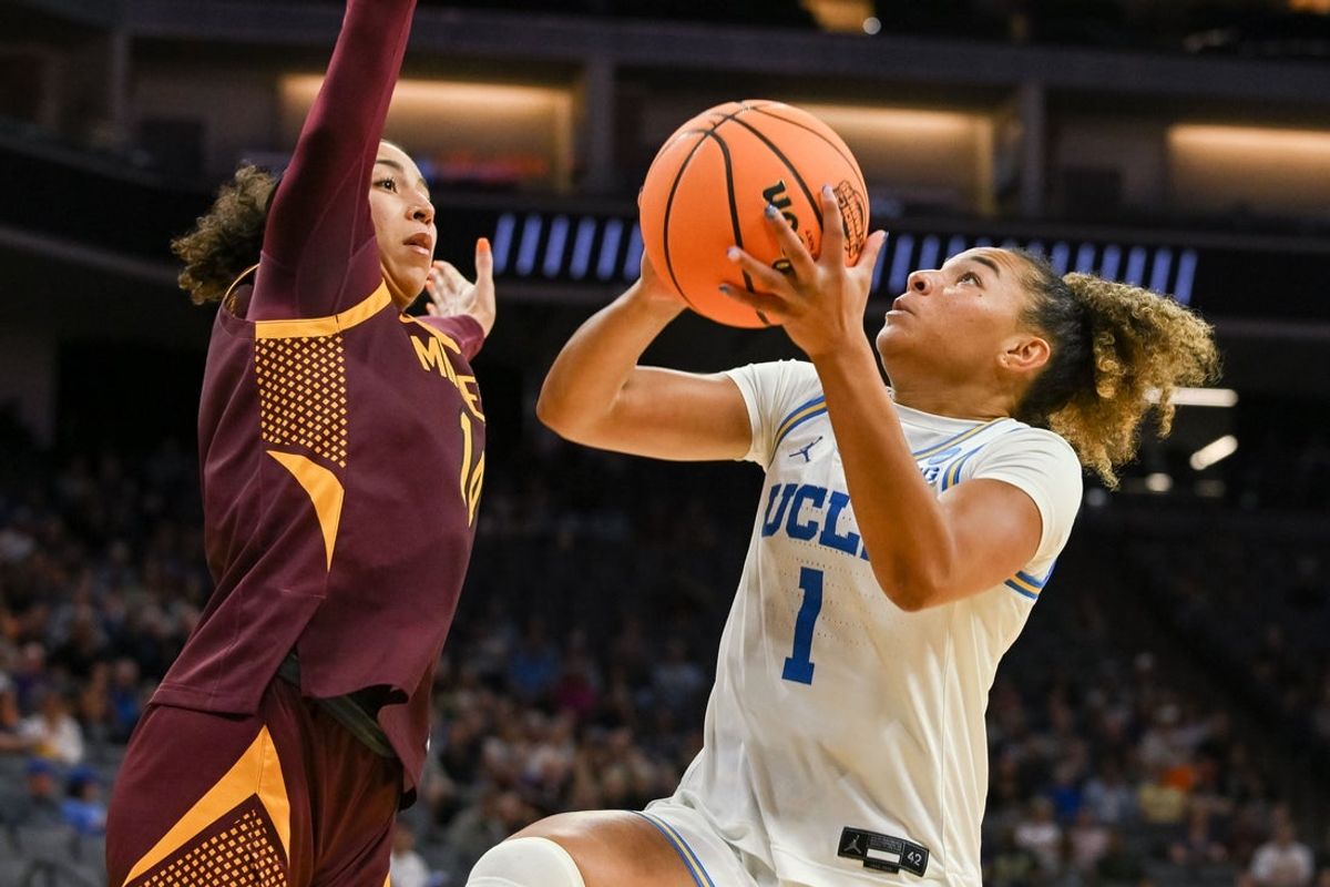 Mar 27, 2026; Sacramento, CA, USA; UCLA Bruins guard Kiki Rice (1) shoots against Minnesota Golden Gophers guard Tori McKinney (14) during a Sweet Sixteen game of the Sacramento Regional 2 of the women's 2026 NCAA Tournament at Golden 1 Center. Mandatory Credit: Ed Szczepanski-Imagn Images