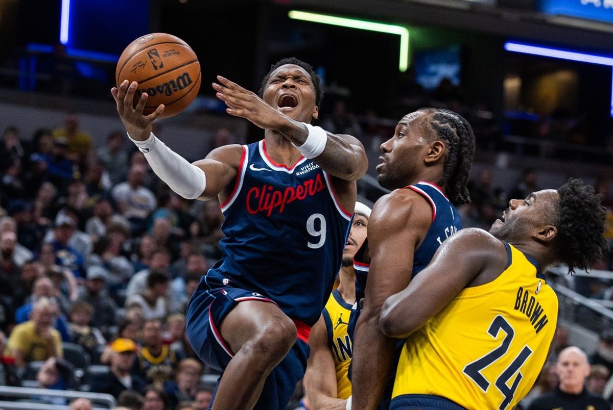 Mar 27, 2026; Indianapolis, Indiana, USA; LA Clippers guard Bennedict Mathurin (9)  shoots against Indiana Pacers guard Kobe Brown (24) in the first half at Gainbridge Fieldhouse. Mandatory Credit: Trevor Ruszkowski-Imagn Images