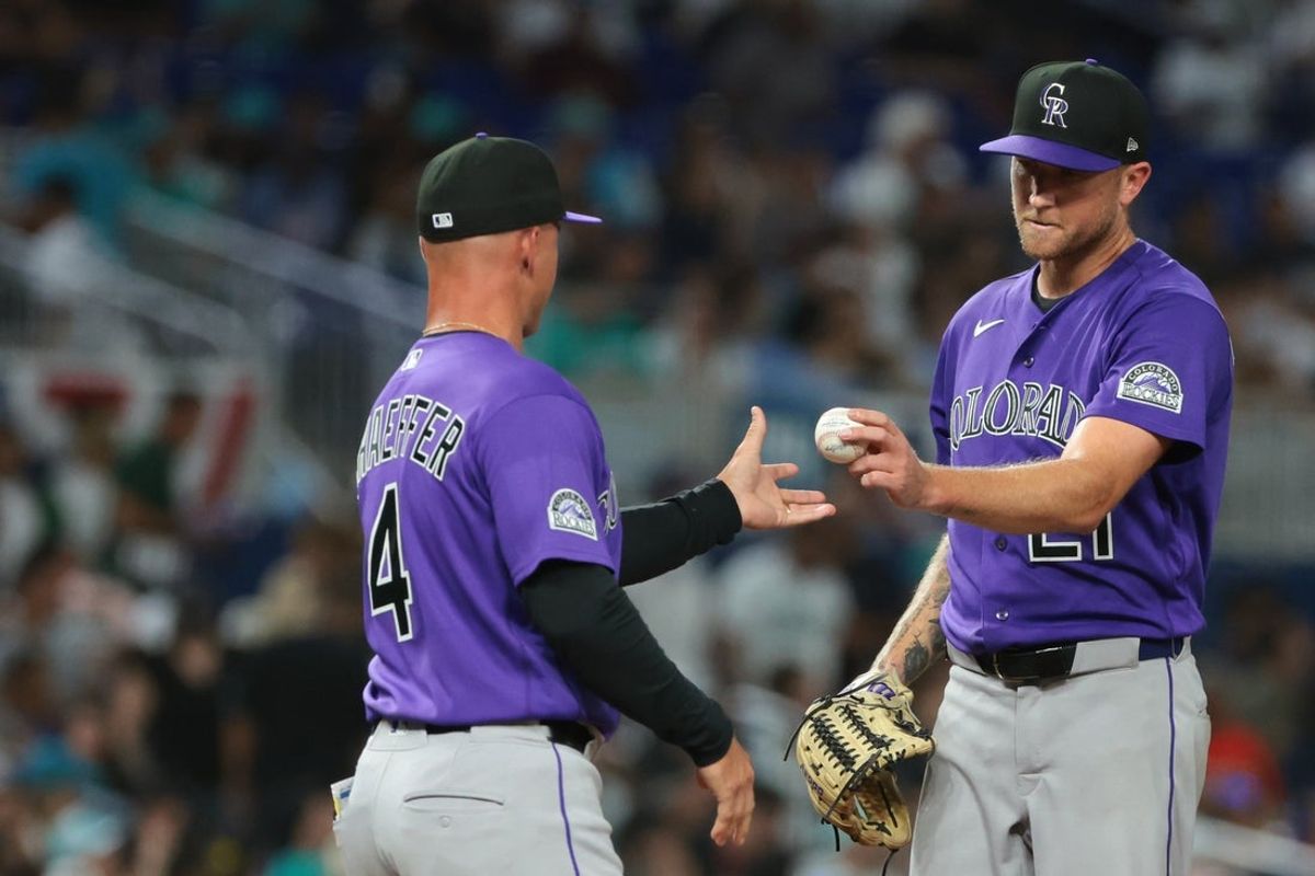 Mar 27, 2026; Miami, Florida, USA; Colorado Rockies starting pitcher Kyle Freeland (21) is removed from the game by manager Warren Schaeffer (4) during the fifth inning against the Miami Marlins at loanDepot Park. Mandatory Credit: Sam Navarro-Imagn Images
