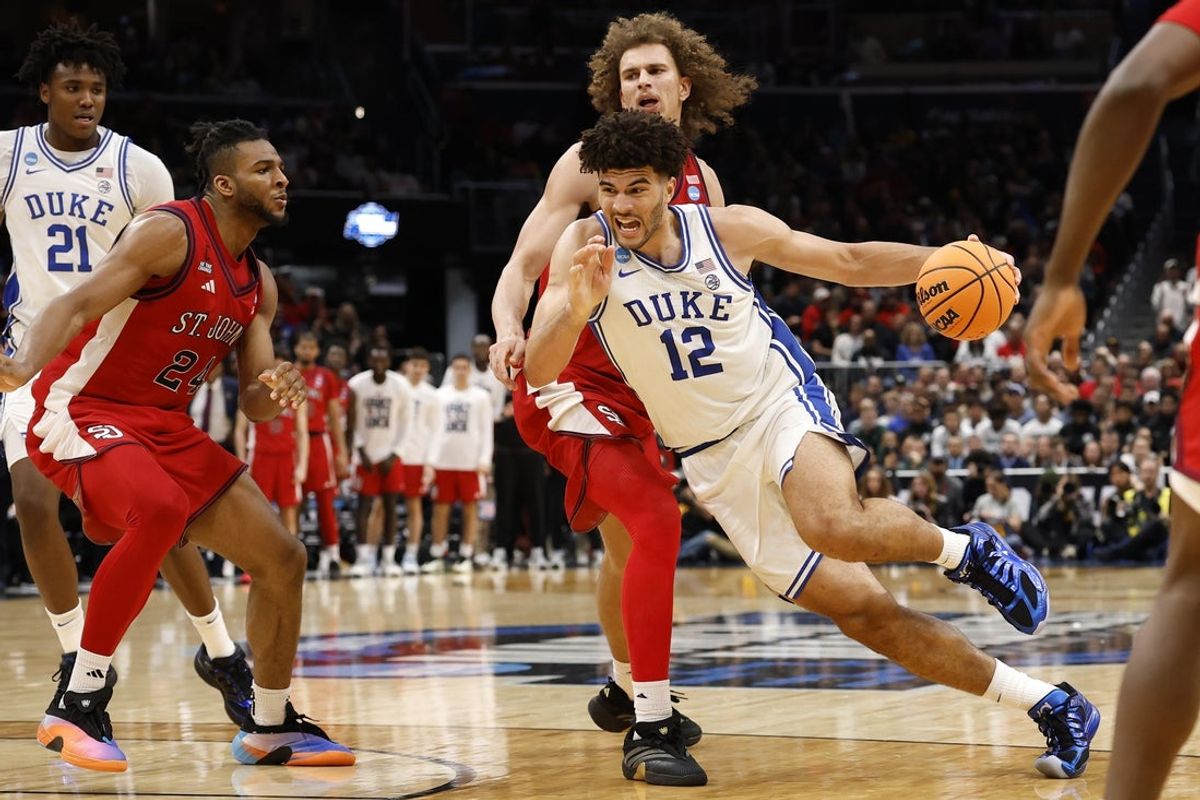 Mar 27, 2026; Washington, DC, USA; Duke Blue Devils forward Cameron Boozer (12) dribbles the ball past St. John's Red Storm forward Ruben Prey (17) in the second half during a Sweet Sixteen game of the East Regional of the men's 2026 NCAA Tournament at Capital One Arena. Mandatory Credit: Geoff Burke-Imagn Images