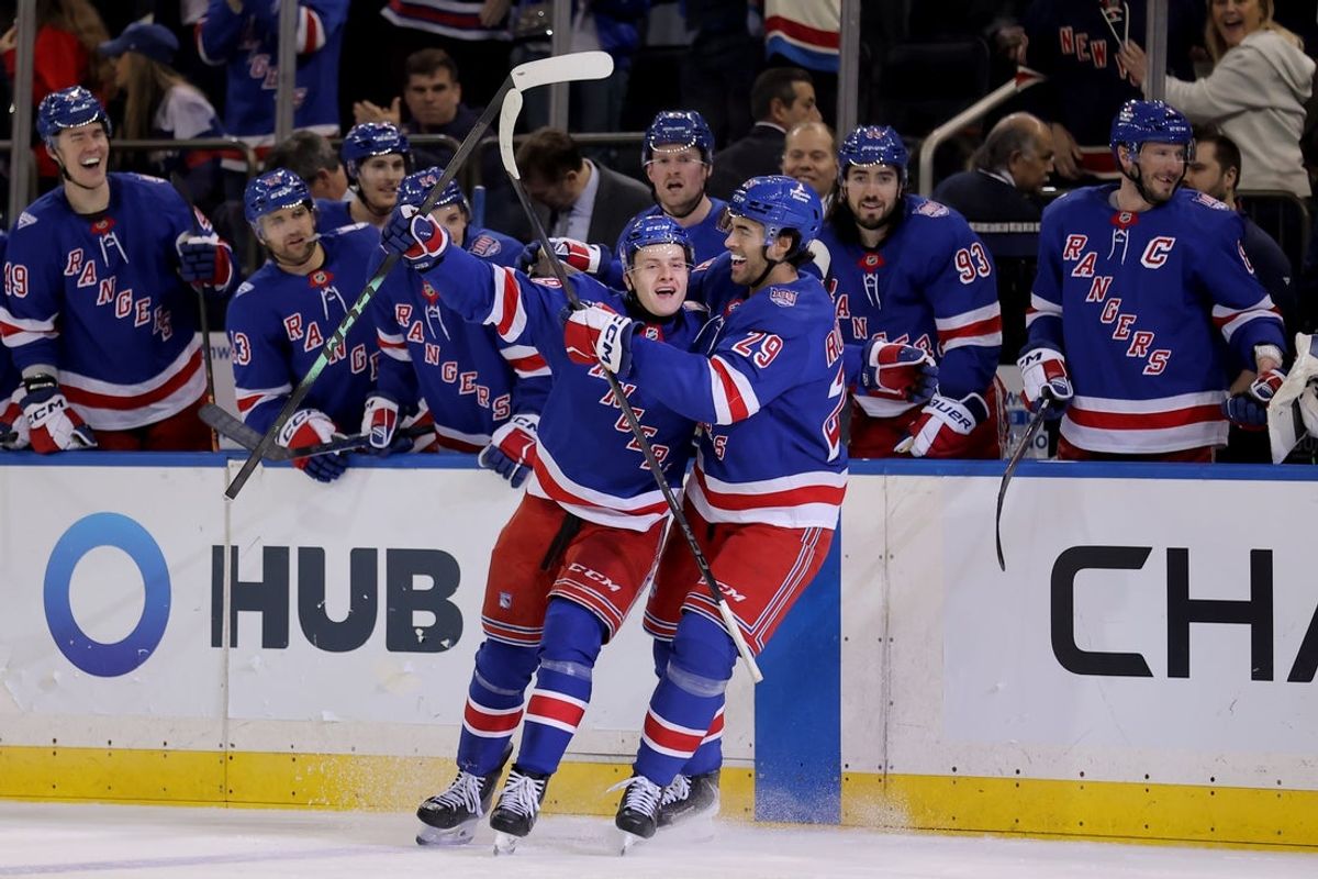 Mar 27, 2026; New York, New York, USA; New York Rangers left wing Adam Sykora (38) celebrates his goal against the Chicago Blackhawks with defenseman Matthew Robertson (29) during the second period at Madison Square Garden. The goal was the first of his NHL career. Mandatory Credit: Brad Penner-Imagn Images