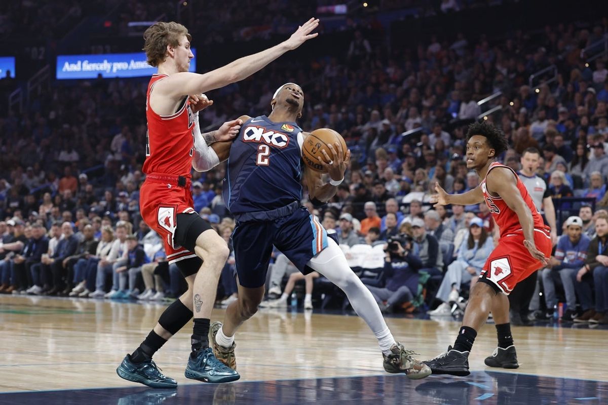 Mar 27, 2026; Oklahoma City, Oklahoma, USA; Oklahoma City Thunder guard Shai Gilgeous-Alexander (2) drives past Chicago Bulls forward Matas Buzelis (14) during the first half at Paycom Center. Mandatory Credit: Alonzo Adams-Imagn Images