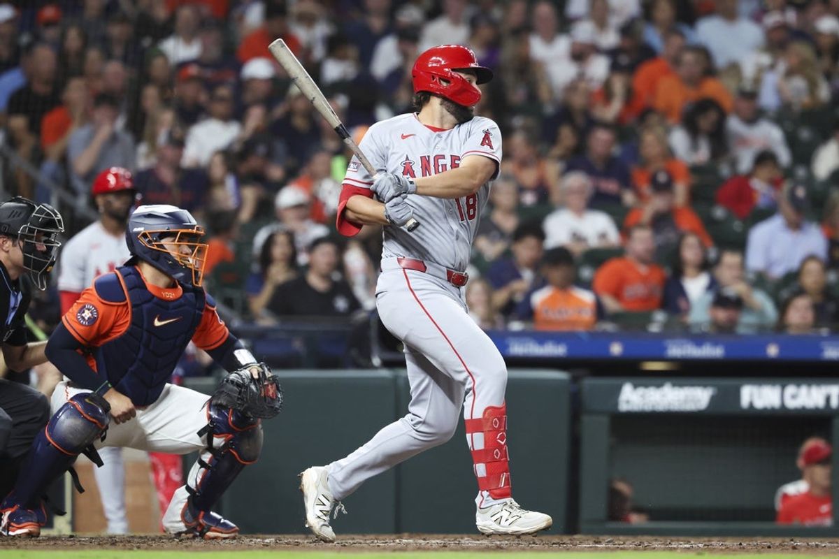 Mar 27, 2026; Houston, Texas, USA; Los Angeles Angels first baseman Nolan Schanuel (18) hits a single during the third inning against the Houston Astros at Daikin Park. Mandatory Credit: Troy Taormina-Imagn Images