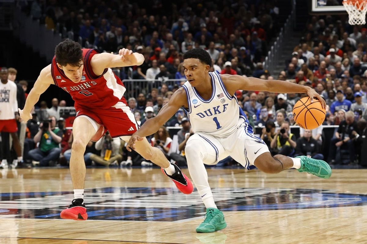 Mar 27, 2026; Washington, DC, USA; Duke Blue Devils guard Caleb Foster (1) dribbles the ball against St. John's Red Storm guard Dylan Darling (0) in the first half during a Sweet Sixteen game of the East Regional of the men's 2026 NCAA Tournament at Capital One Arena. Mandatory Credit: Amber Searls-Imagn Images