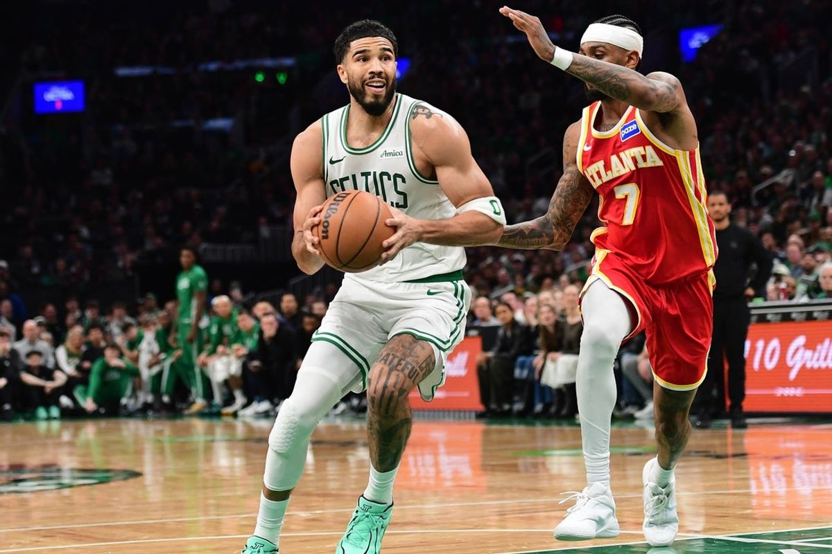 Mar 27, 2026; Boston, Massachusetts, USA; Boston Celtics forward Jayson Tatum (0) drives against Atlanta Hawks guard Nickeil Alexander-Walker (7) during the second half at TD Garden. Mandatory Credit: Bob DeChiara-Imagn Images