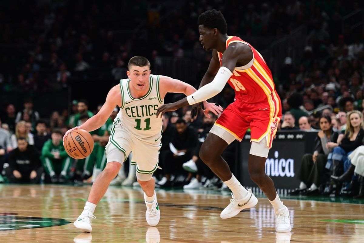 Mar 27, 2026; Boston, Massachusetts, USA; Boston Celtics guard Payton Pritchard (11) dribbles against Atlanta Hawks forward Mouhamed Gueye (18) during the second half at TD Garden. Mandatory Credit: Bob DeChiara-Imagn Images