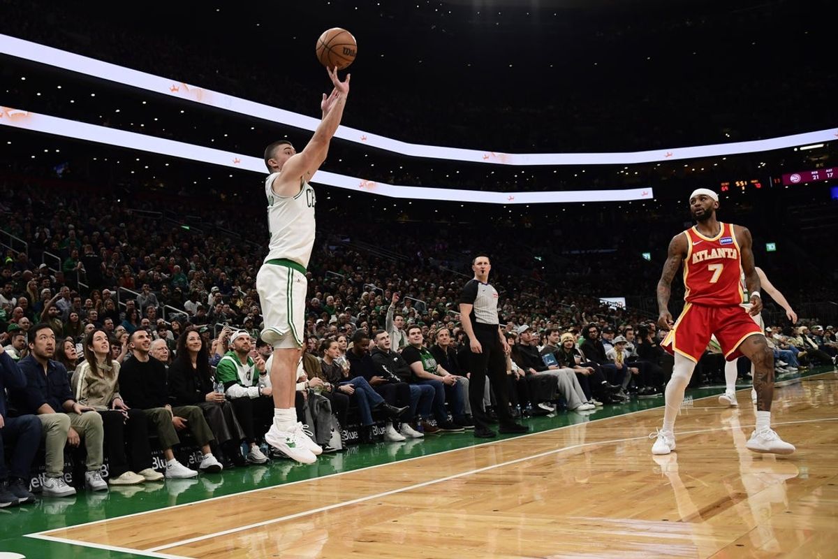 Mar 27, 2026; Boston, Massachusetts, USA; Boston Celtics guard Payton Pritchard (11) shoots against Atlanta Hawks guard Nickeil Alexander-Walker (7) during the second half at TD Garden. Mandatory Credit: Bob DeChiara-Imagn Images