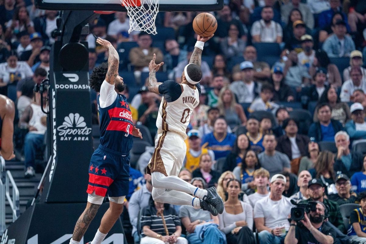 Mar 27, 2026; San Francisco, California, USA; Golden State Warriors guard Gary Payton II (0) drives against Washington Wizards forward Justin Champagnie (9) during the first quarter at Chase Center. Mandatory Credit: Neville E. Guard-Imagn Images