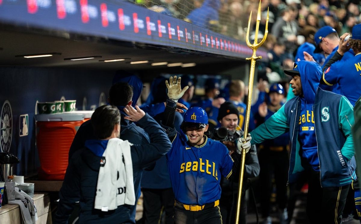 Mar 27, 2026; Seattle, Washington, USA; Seattle Mariners second baseman Cole Young (2) celebrates in the dugout after hitting a three-run home run during the fourth inning against the Cleveland Guardians at T-Mobile Park. Mandatory Credit: Stephen Brashear-Imagn Images