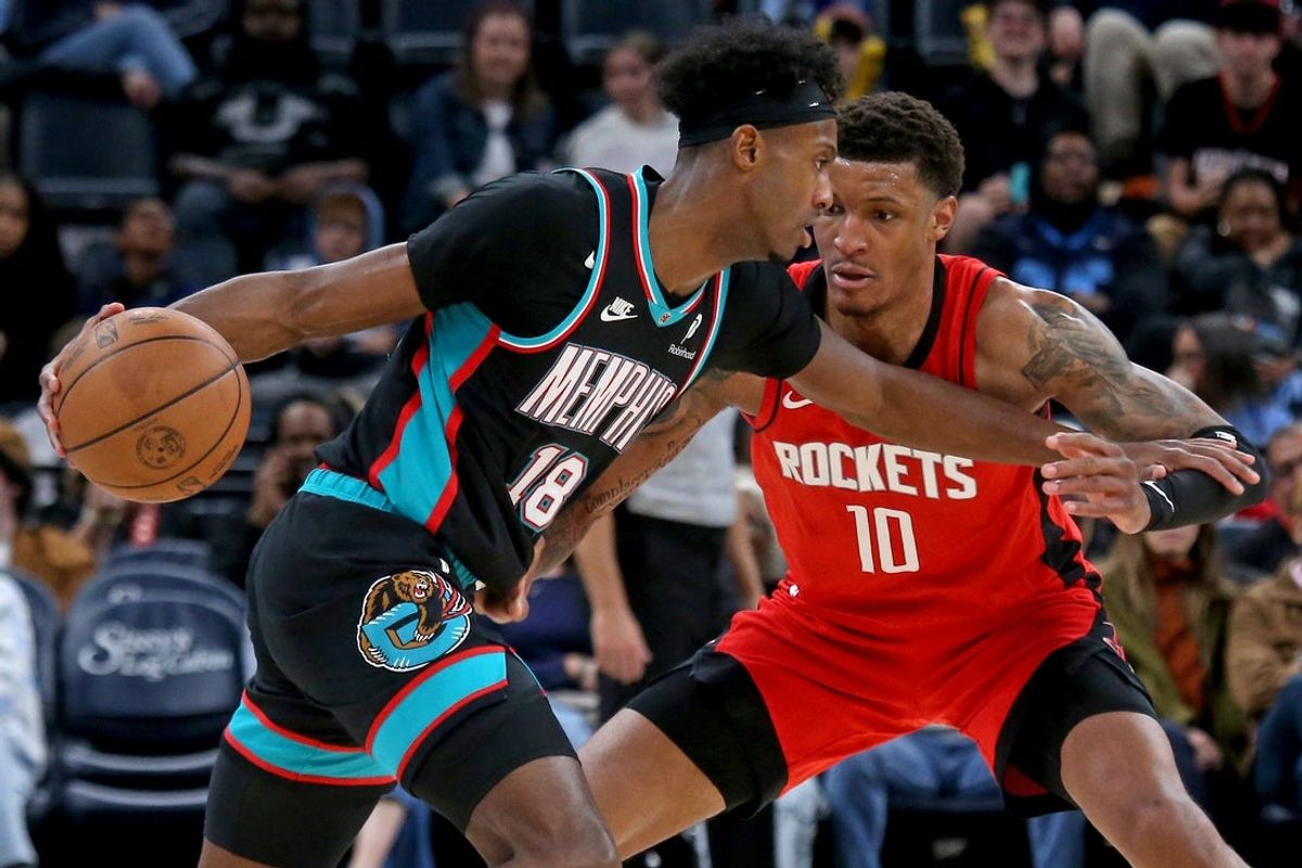 Mar 27, 2026; Memphis, Tennessee, USA; Memphis Grizzlies forward Olivier-Maxence Prosper (18) dribbles against Houston Rockets forward Jabari Smith Jr. (10) during the third quarter at FedExForum. Mandatory Credit: Petre Thomas-Imagn Images