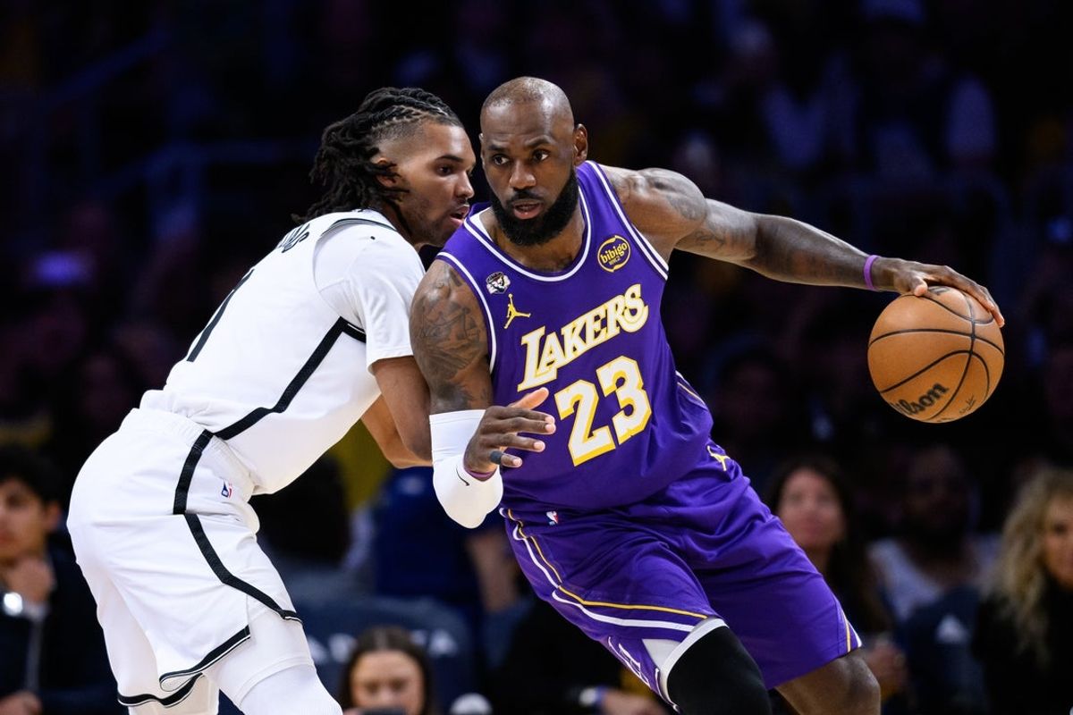 Mar 27, 2026; Los Angeles, California, USA; Los Angeles Lakers forward LeBron James (23) dribbles against Brooklyn Nets forward Ziaire Williams (1) during the first half at Crypto.com Arena. Mandatory Credit: William Liang-Imagn Images