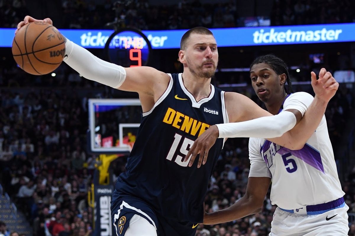 Mar 27, 2026; Denver, Colorado, USA; Denver Nuggets center Nikola Jokic (15) works against Utah Jazz forward Cody Williams (5) during the second half at Ball Arena. Mandatory Credit: Christopher Hanewinckel-Imagn Images