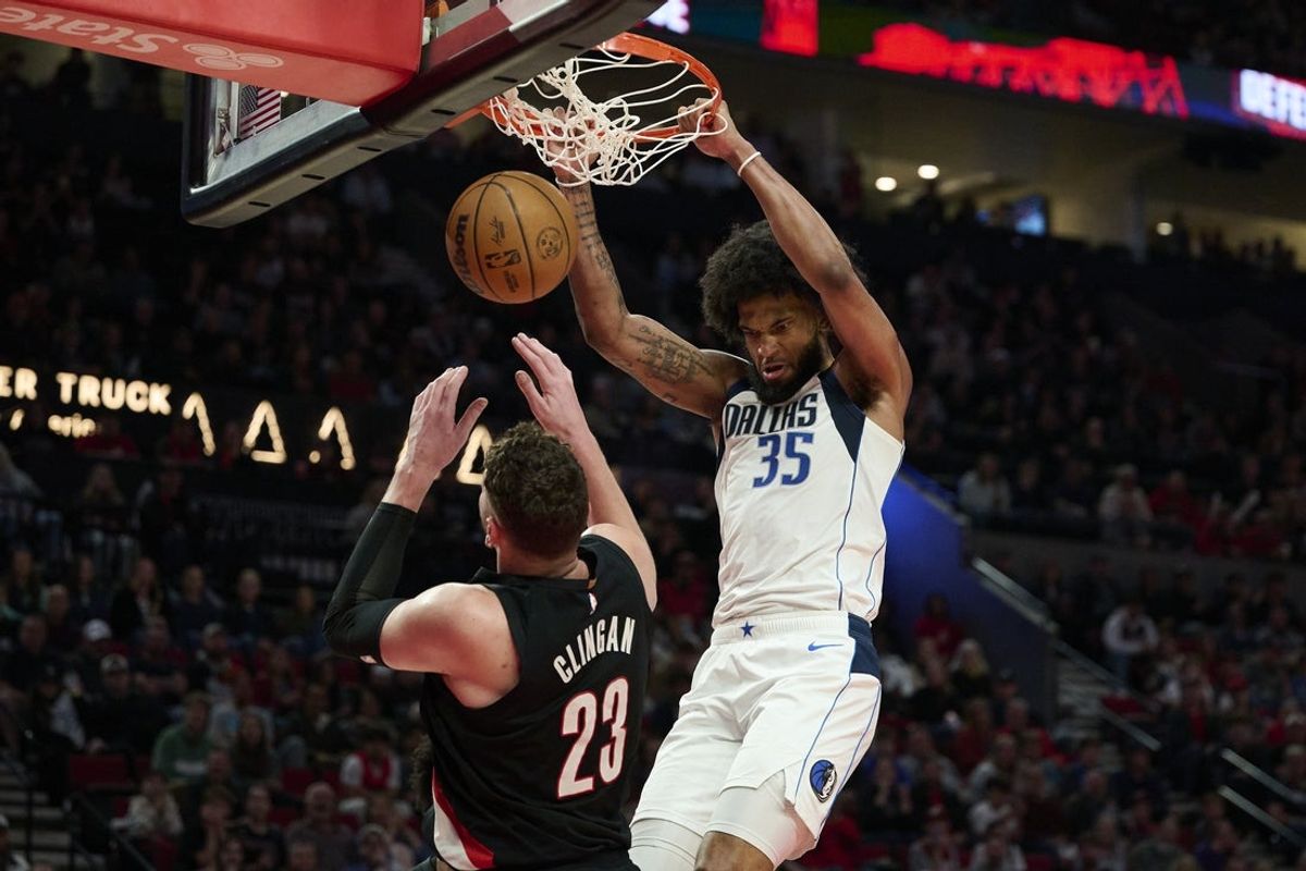 Mar 27, 2026; Portland, Oregon, USA; Dallas Mavericks forward Marvin Bagley III (35) dunks the basketball during the second half against Portland Trail Blazers center Donovan Clingan (23) at Moda Center. Mandatory Credit: Troy Wayrynen-Imagn Images