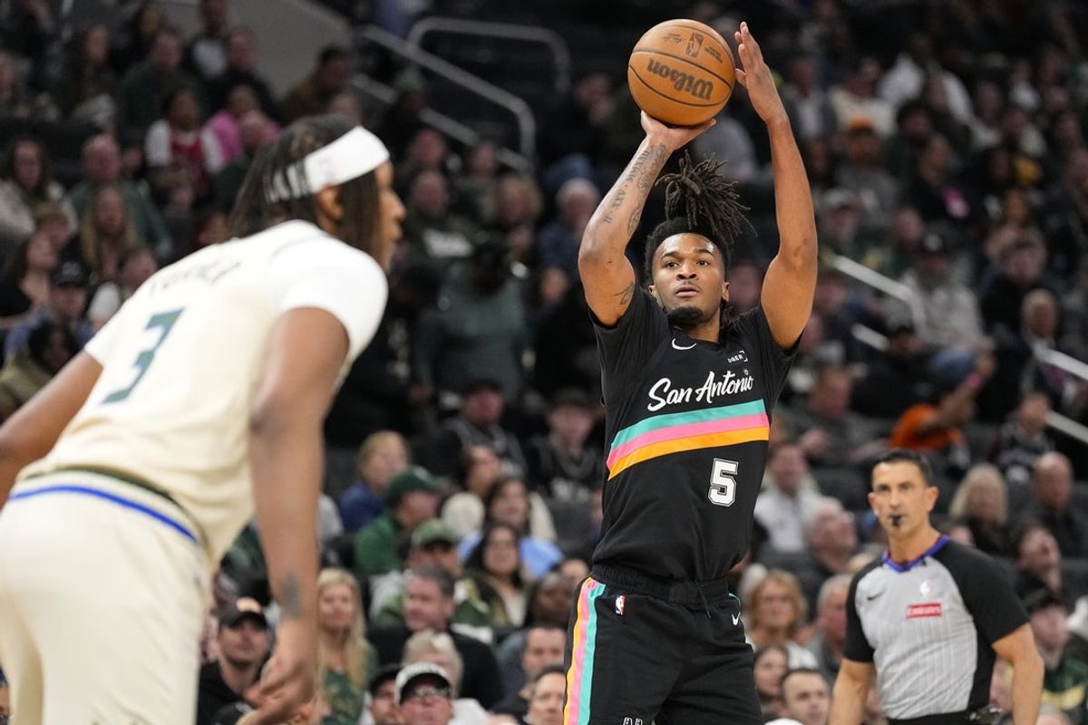 Mar 28, 2026; Milwaukee, Wisconsin, USA;  San Antonio Spurs guard Stephon Castle (5) shoots during the first quarter against the Milwaukee Bucks at Fiserv Forum. Mandatory Credit: Jeff Hanisch-Imagn Images
