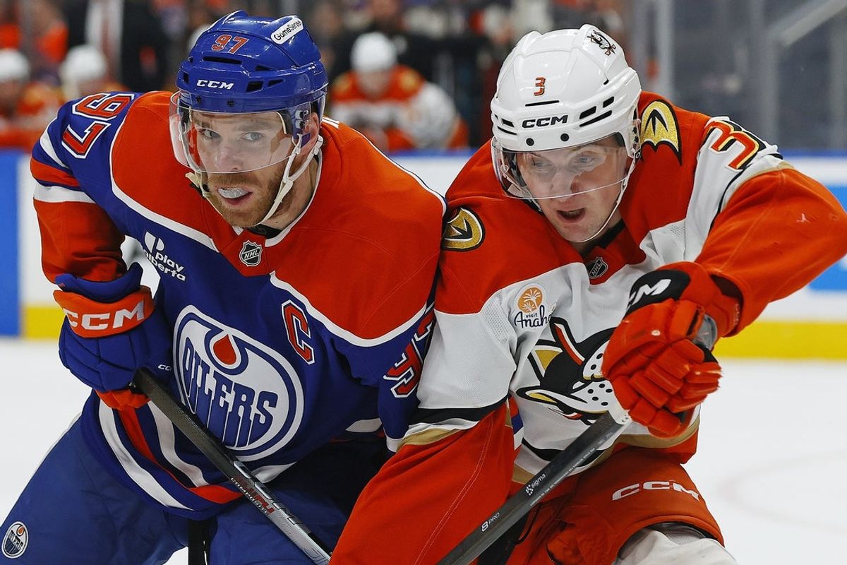 Mar 28, 2026; Edmonton, Alberta, CAN; Edmonton Oilers forward Connor McDavid (97) and Anaheim Ducks defensemen Ian Moore (3) battles for position during the first period at Rogers Place. Mandatory Credit: Perry Nelson-Imagn Images
