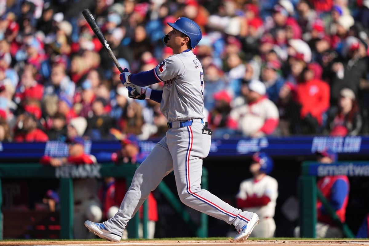 Mar 28, 2026; Philadelphia, Pennsylvania, USA; Texas Rangers infielder Corey Seager (5) hits a home run against the Philadelphia Phillies in the first inning at Citizens Bank Park. Mandatory Credit: Kyle Ross-Imagn Images