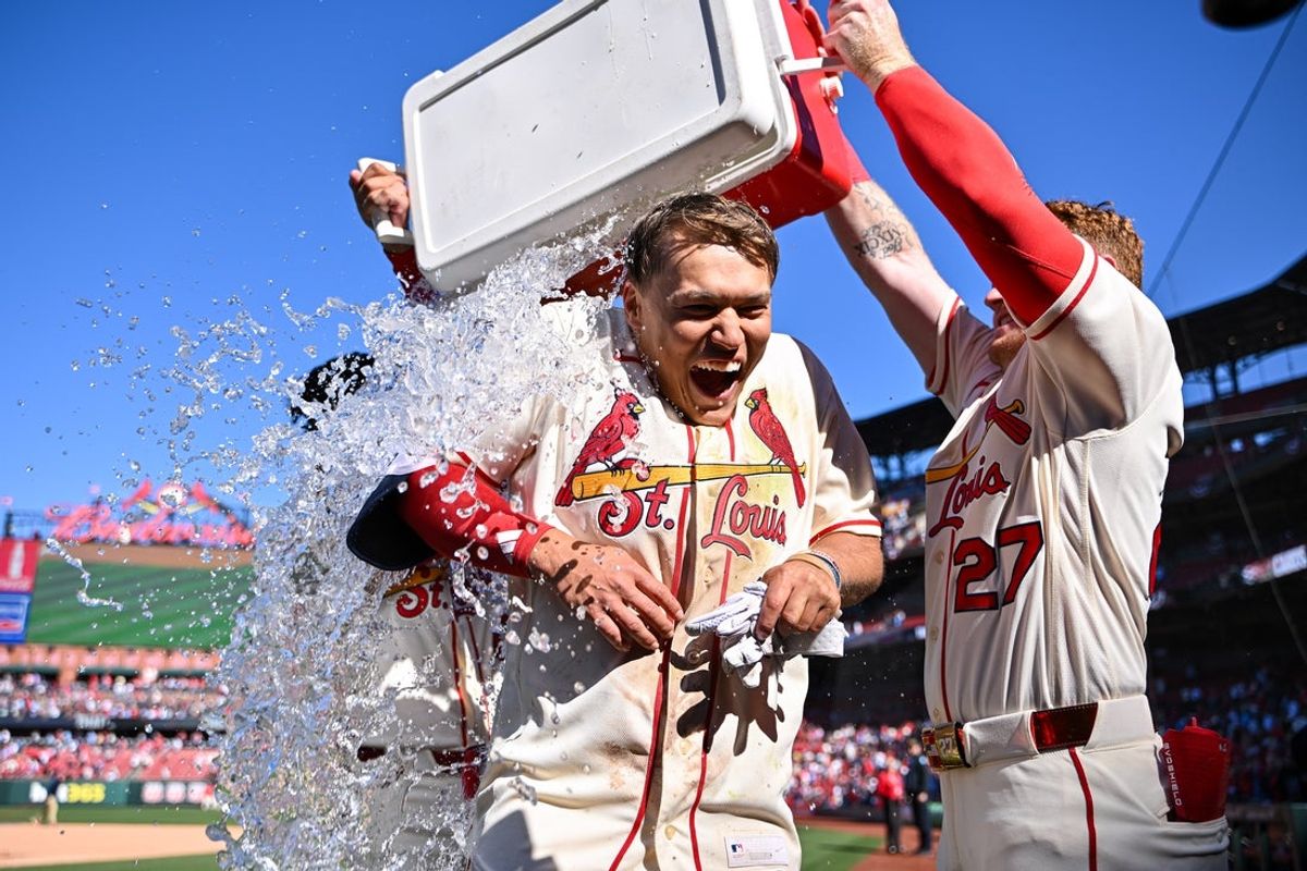 Mar 28, 2026; St. Louis, Missouri, USA; St. Louis Cardinals shortstop JJ Wetherholt (26) is doused with water by shortstop Masyn Winn (0) and left fielder Nathan Church (27) after hitting a walk-off two run single against the Tampa Bay Rays during the tenth inning at Busch Stadium. Mandatory Credit: Jeff Curry-Imagn Images