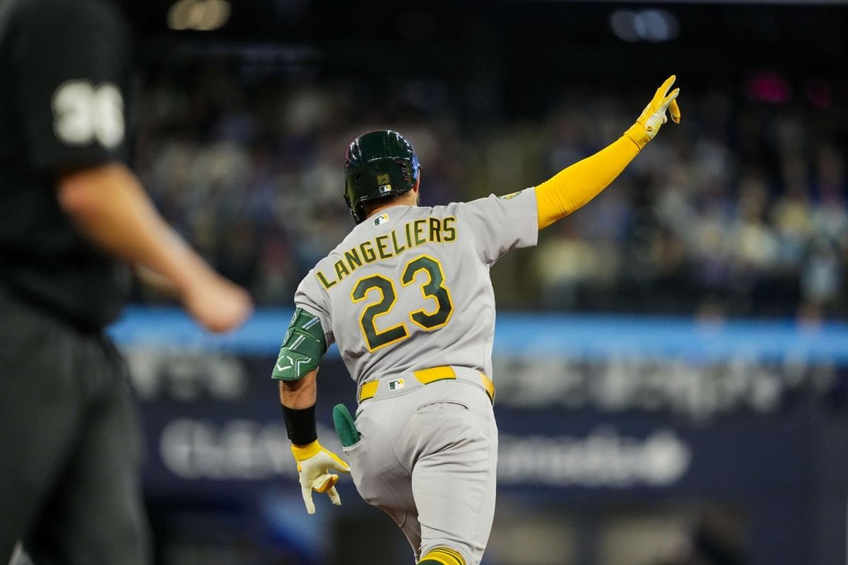 Mar 28, 2026; Toronto, Ontario, CAN; Athletics catcher Shea Langeliers (23) celebrates hitting a grand slam against the Toronto Blue Jays during the seventh inning at Rogers Centre. Mandatory Credit: Kevin Sousa-Imagn Images