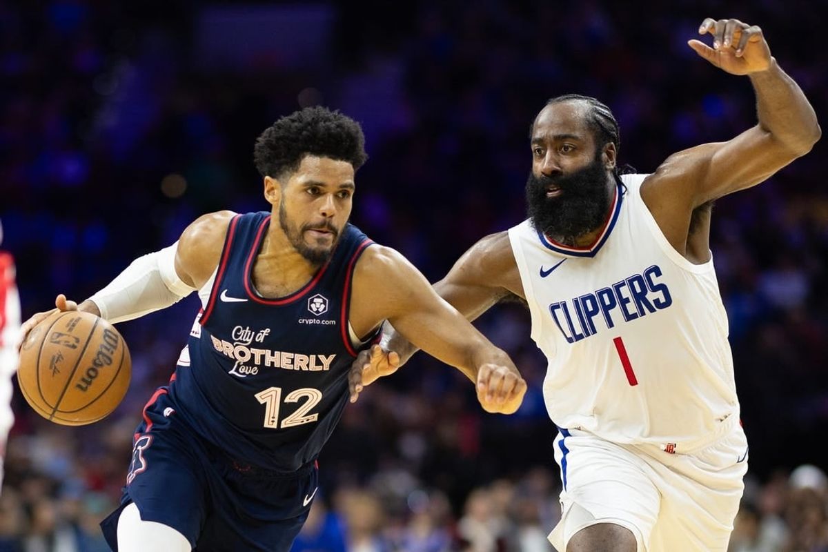 Mar 27, 2024; Philadelphia, Pennsylvania, USA; Philadelphia 76ers forward Tobias Harris (12) dribbles the ball against LA Clippers guard James Harden (1) during the second quarter at Wells Fargo Center.