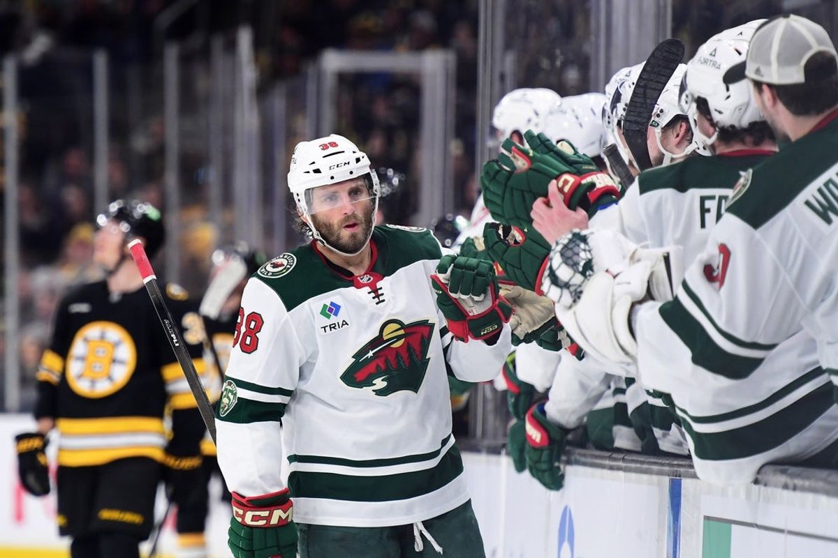 Mar 28, 2026; Boston, Massachusetts, USA; Minnesota Wild right wing Ryan Hartman (38) is congratulated by his teammates after scoring a goal during the third period against the Boston Bruins at TD Garden. Mandatory Credit: Bob DeChiara-Imagn Images