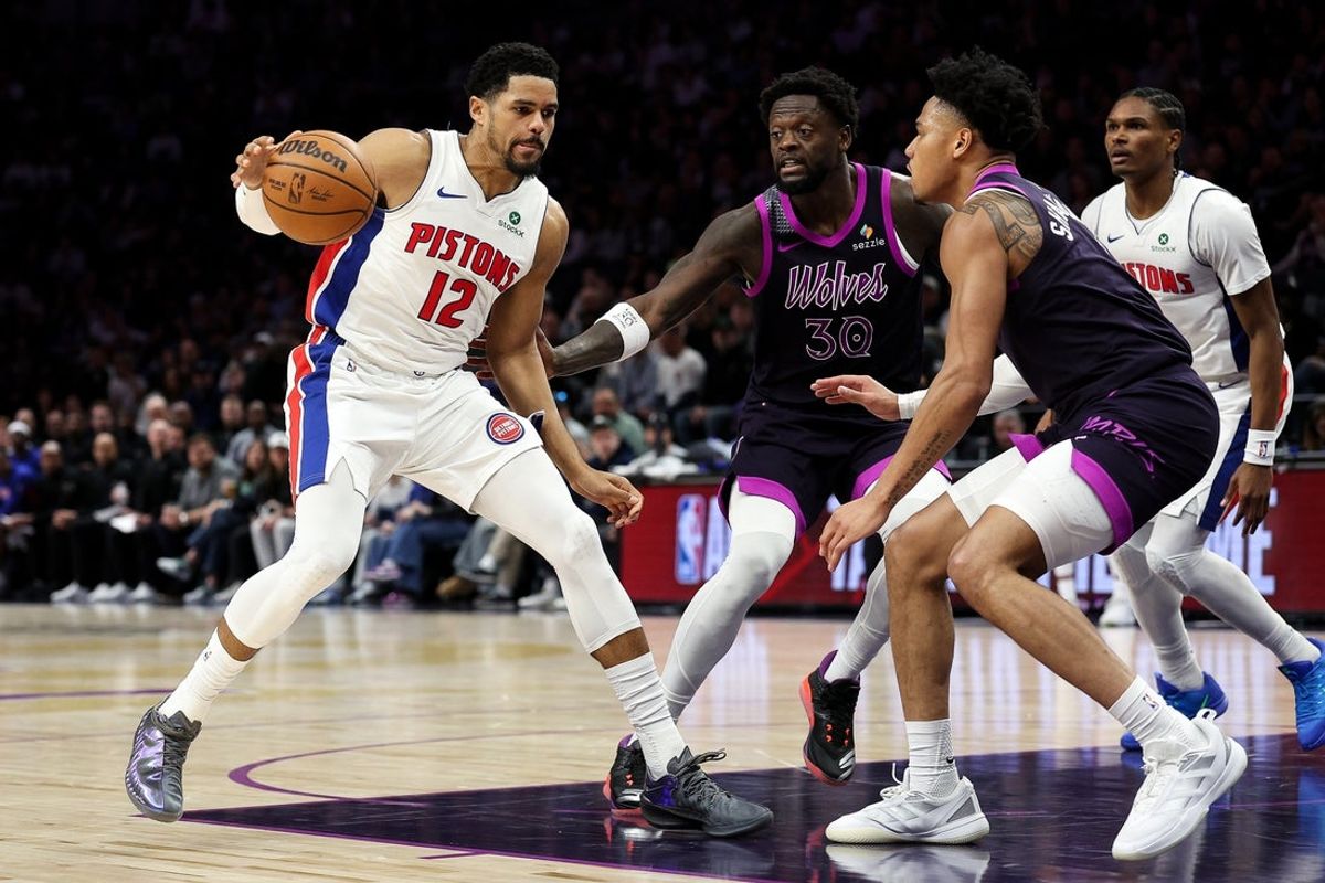 Mar 28, 2026; Minneapolis, Minnesota, USA; Detroit Pistons forward Tobias Harris (12) dribbles the ball as Minnesota Timberwolves forward Julius Randle (30) and guard Terrence Shannon Jr. (1) defend during the second half at Target Center. Mandatory Credit: Matt Krohn-Imagn Images