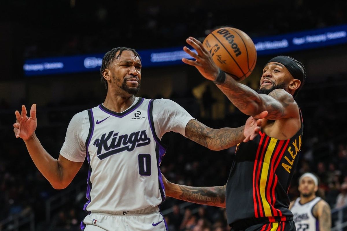 Mar 28, 2026; Atlanta, Georgia, USA; Sacramento Kings guard Malik Monk (0) reaches for the ball against Atlanta Hawks guard Nickeil Alexander-Walker (7) during the first quarter at State Farm Arena. Mandatory Credit: Jordan Godfree-Imagn Images