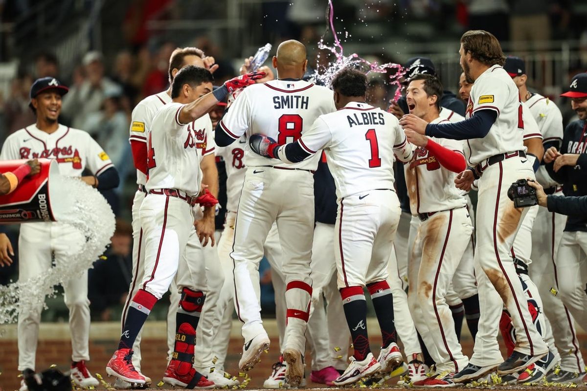 Mar 28, 2026; Cumberland, Georgia, USA; Atlanta Braves first baseman Dominic Smith (8) hits a walk-off grand slam against the Kansas City Royals in the ninth inning at Truist Park. Mandatory Credit: Mady Mertens-Imagn Images