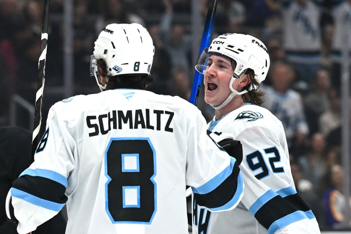 Mar 28, 2026; Los Angeles, California, USA; Utah Mammoth center Logan Cooley (92) celebrates with Utah Mammoth center Nick Schmaltz (8) after scoring a goal against the Los Angeles Kings at Crypto.com Arena. Mandatory Credit: Griffin Hooper-Imagn Images