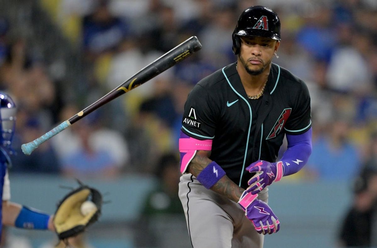 Mar 28, 2026; Los Angeles, California, USA; Arizona Diamondbacks second baseman Ketel Marte (4) tosses his bat after walking during the fifth inning against the Los Angeles Dodgers at Dodger Stadium. Mandatory Credit: Jayne Kamin-Oncea-Imagn Images
