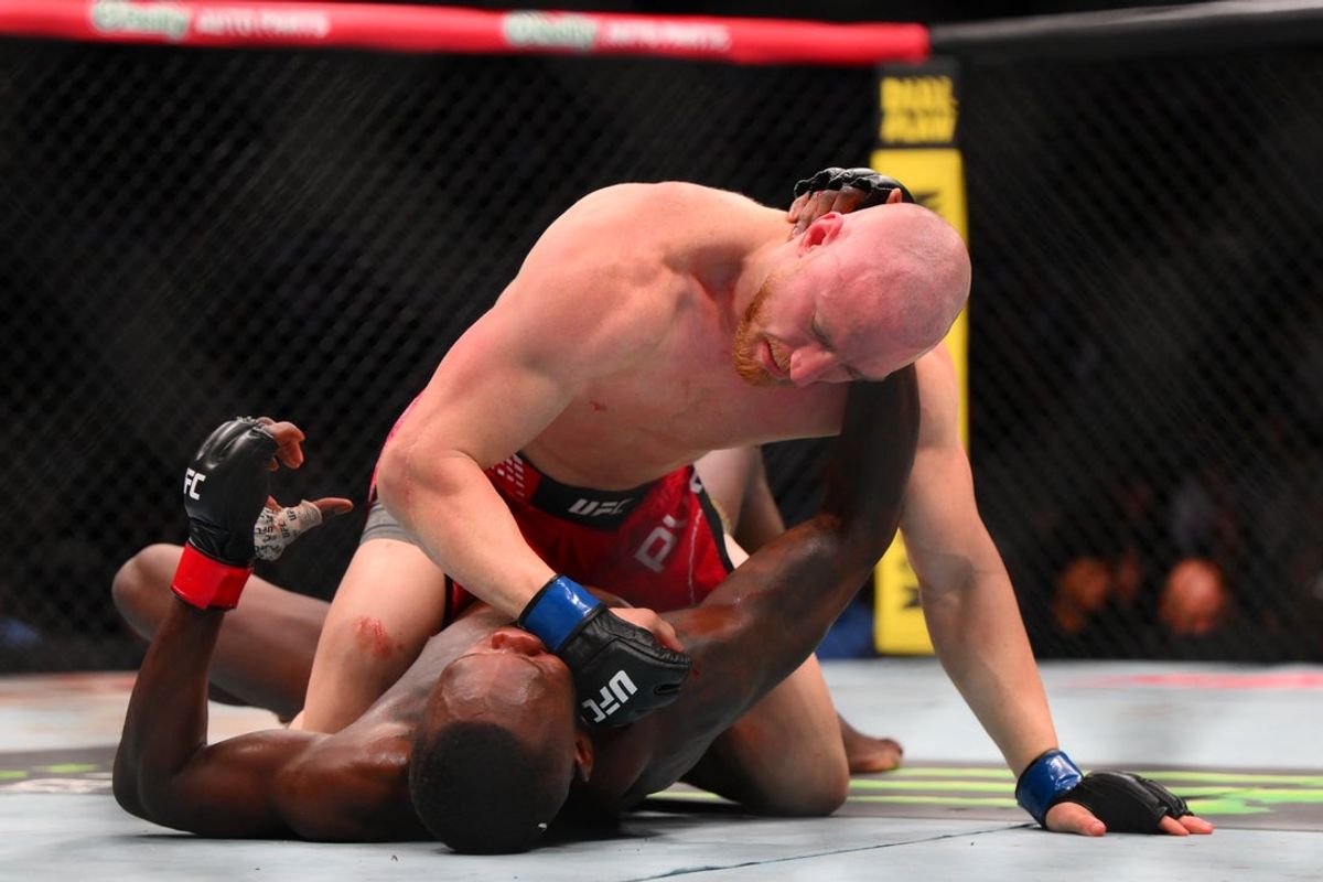 Mar 28, 2026; Seattle, Washington, USA; Israel Adesanya (red gloves) fights Joe Pyfer (blue gloves) during UFC Fight Night at Climate Pledge Arena. Mandatory Credit: Steven Bisig-Imagn Images