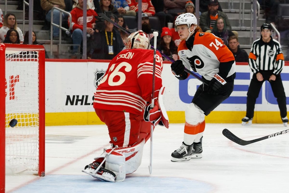 Mar 28, 2026; Detroit, Michigan, USA;  Philadelphia Flyers right wing Owen Tippett (74) skates with the puck in the third period scores on Detroit Red Wings goaltender John Gibson (36) in the third period at Little Caesars Arena. Mandatory Credit: Rick Osentoski-Imagn Images
