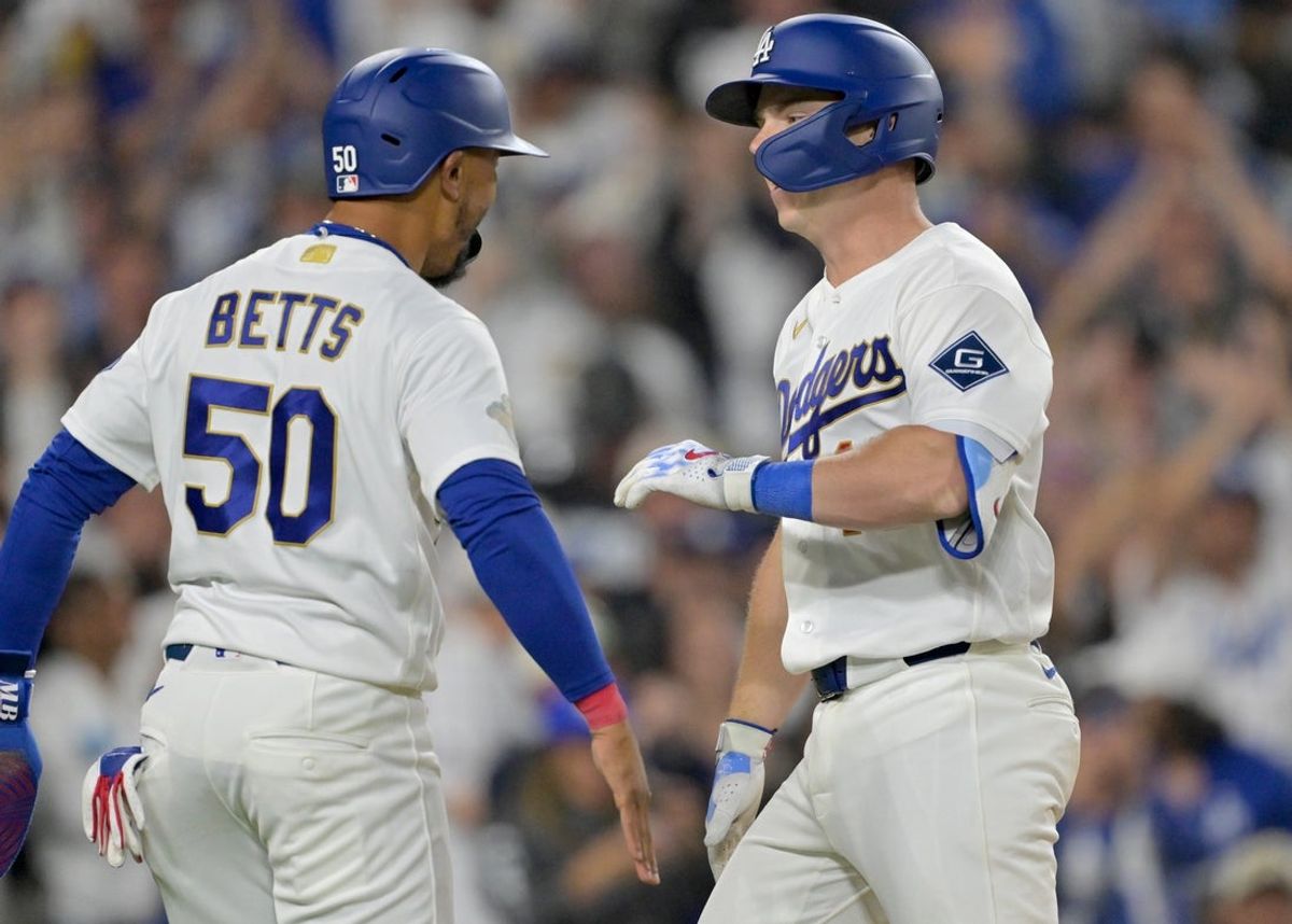 Mar 28, 2026; Los Angeles, California, USA; Los Angeles Dodgers catcher Will Smith (16) celebrates with shortstop Mookie Betts (50) after hitting a two-run home run during the eighth inning against the Arizona Diamondbacks at Dodger Stadium. Mandatory Credit: Jayne Kamin-Oncea-Imagn Images