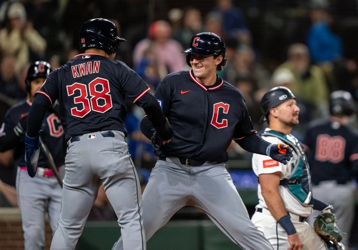 Mar 28, 2026; Seattle, Washington, USA; Cleveland Guardians designated hitter Chase DeLauter (24) celegbrates with centerfielder Steven Kwan (38) after hitting a two-run home run during the tenth inning against the Seattle Mariners at T-Mobile Park. Mandatory Credit: Stephen Brashear-Imagn Images