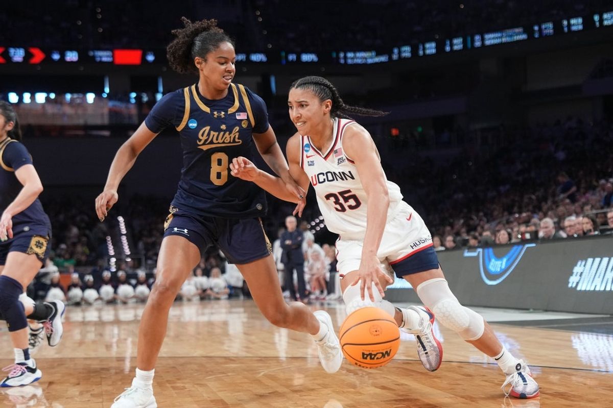 Mar 29, 2026; Fort Worth, TX, USA; UConn Huskies guard Azzi Fudd (35) drives to the basket as Notre Dame Fighting Irish guard Cassandre Prosper (8) defends during the first half at Dickies Arena. Mandatory Credit: Chris Jones-Imagn Images