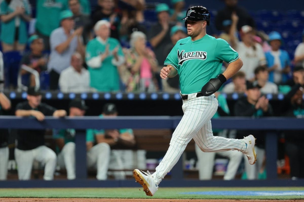 Mar 29, 2026; Miami, Florida, USA; Miami Marlins center fielder Jakob Marsee (87) scores after an RBI double by shortstop Otto Lopez (not pictured) against the Colorado Rockies during the first inning at loanDepot Park. Mandatory Credit: Sam Navarro-Imagn Images
