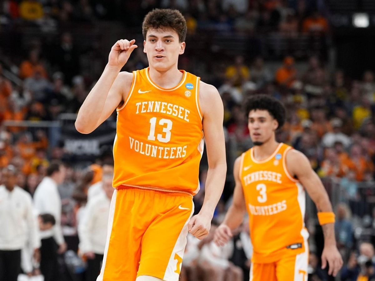 Tennessee forward J.P. Estrella (13) signals a close shot during the NCAA Tournament Elite 8 game against Michigan at the United Center in Chicago on March 29, 2026.
