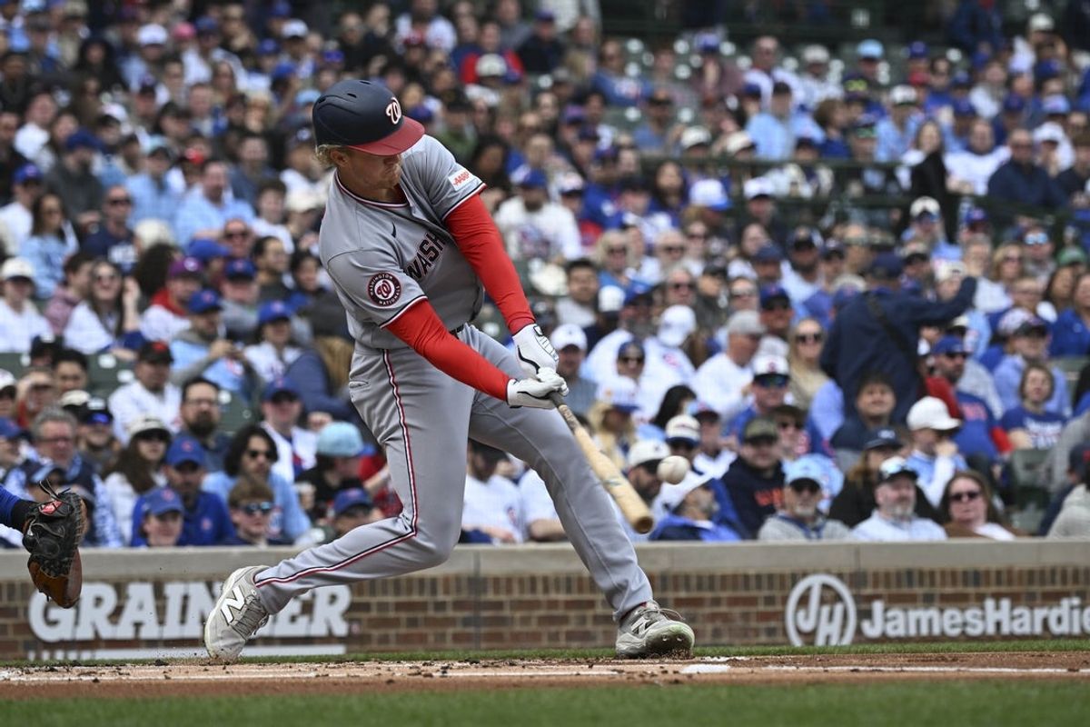 Mar 29, 2026; Chicago, Illinois, USA;  Washington Nationals left fielder Joey Wiemer (21) hits a three-run home run during the first inning against the Chicago Cubs at Wrigley Field. Mandatory Credit: Matt Marton-Imagn Images