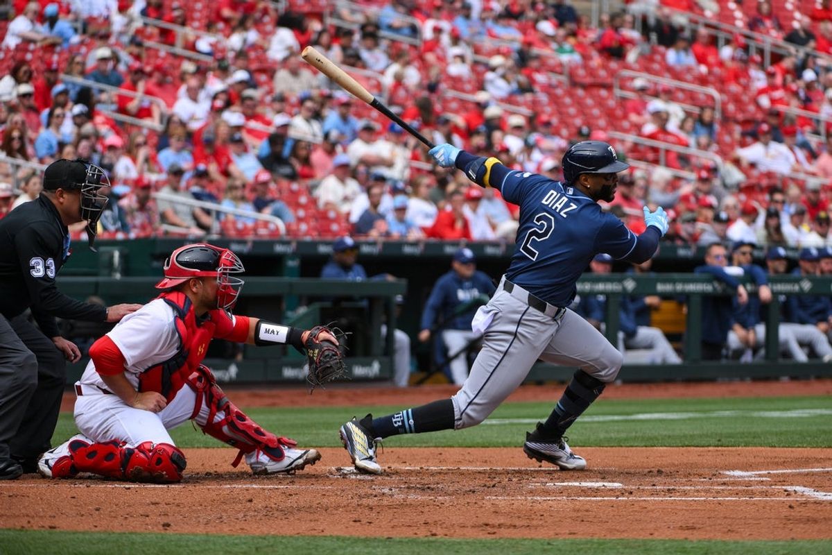 Mar 29, 2026; St. Louis, Missouri, USA; Tampa Bay Rays designated hitter Yandy Díaz (2) hits a one run single against the St. Louis Cardinals during the second inning at Busch Stadium. Mandatory Credit: Jeff Curry-Imagn Images