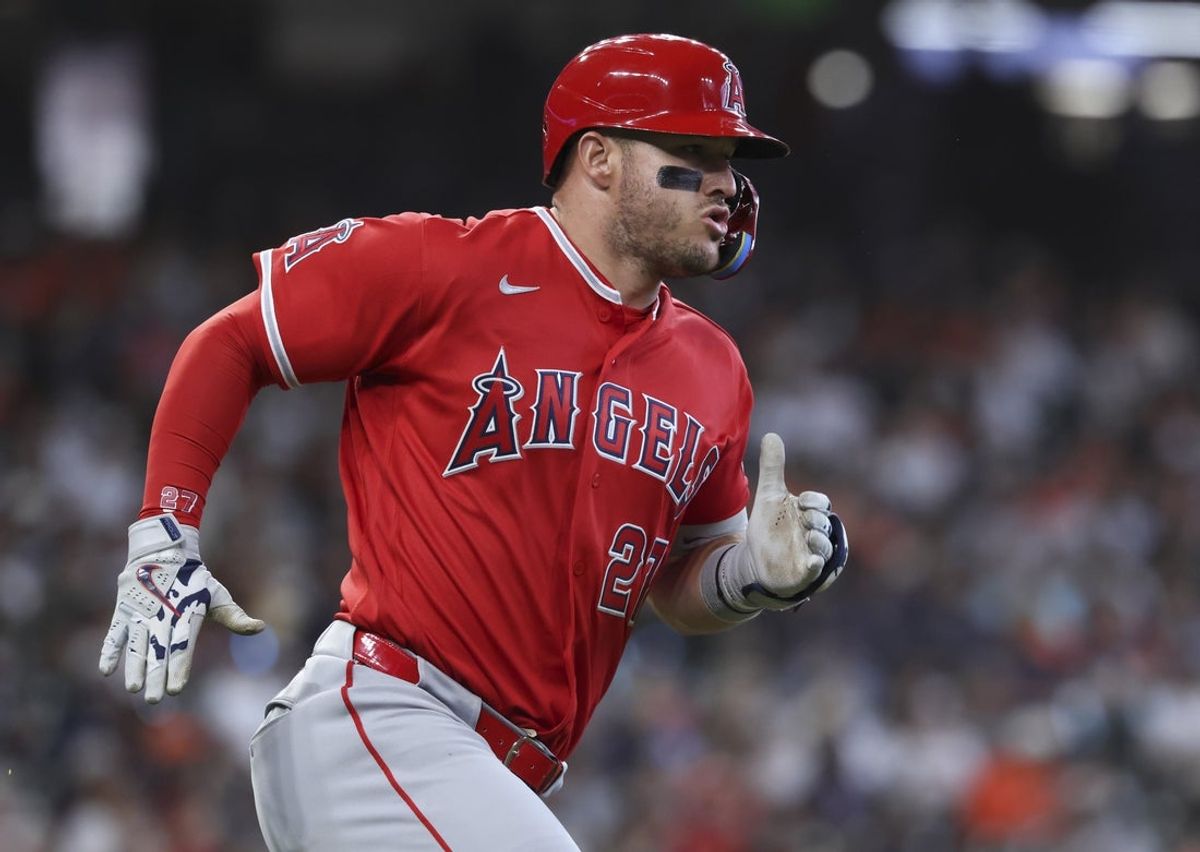 Mar 29, 2026; Houston, Texas, USA; Los Angeles Angels designated hitter Mike Trout (27) runs to first base on a single during the third inning against the Houston Astros at Daikin Park. Mandatory Credit: Troy Taormina-Imagn Images