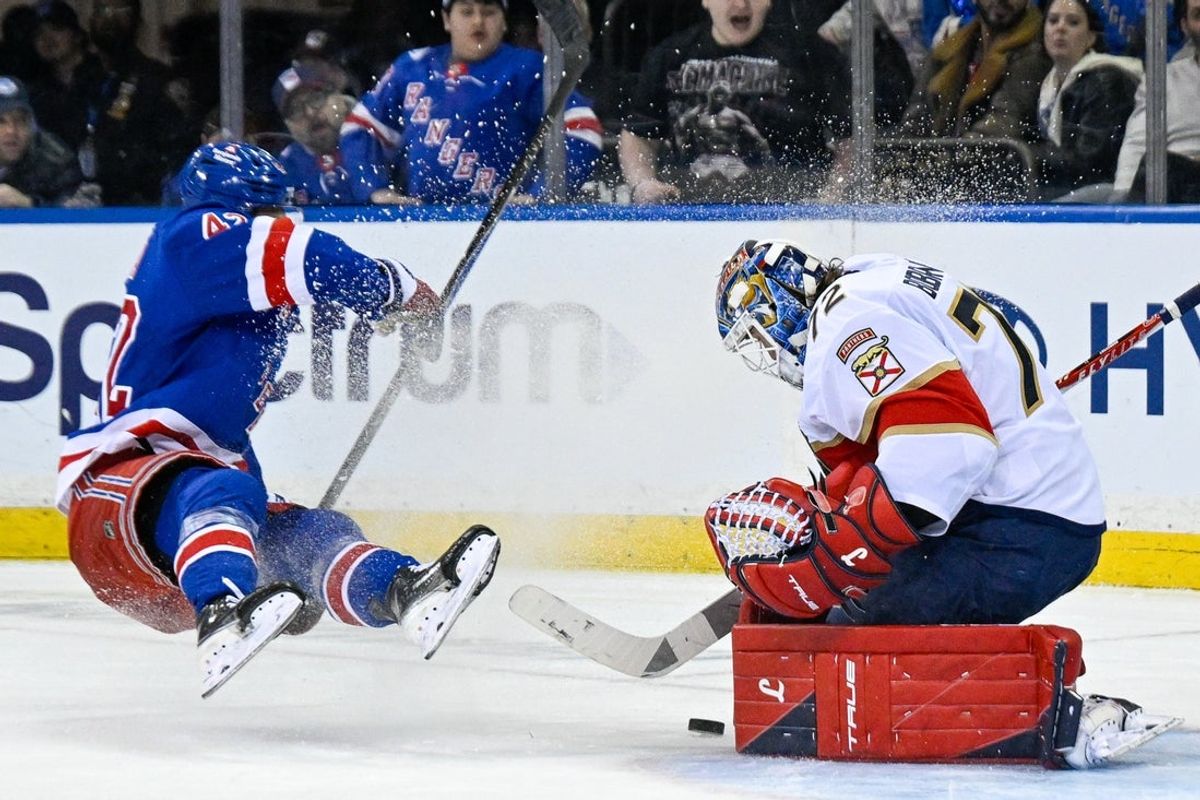 Mar 29, 2026; New York, New York, USA;  Florida Panthers goaltender Sergei Bobrovsky (72) makes a save on New York Rangers center Noah Laba (42) during the third period at Madison Square Garden. Mandatory Credit: Dennis Schneidler-Imagn Images