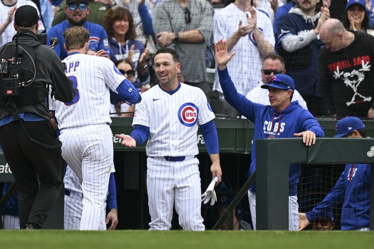 Mar 29, 2026; Chicago, Illinois, USA; Chicago Cubs left fielder Ian Happ (8) celebrates with third baseman Alex Bregman (3) and manager Craig Counsell (11) after he homers during the fourth inning against the Washington Nationals at Wrigley Field. Mandatory Credit: Matt Marton-Imagn Images