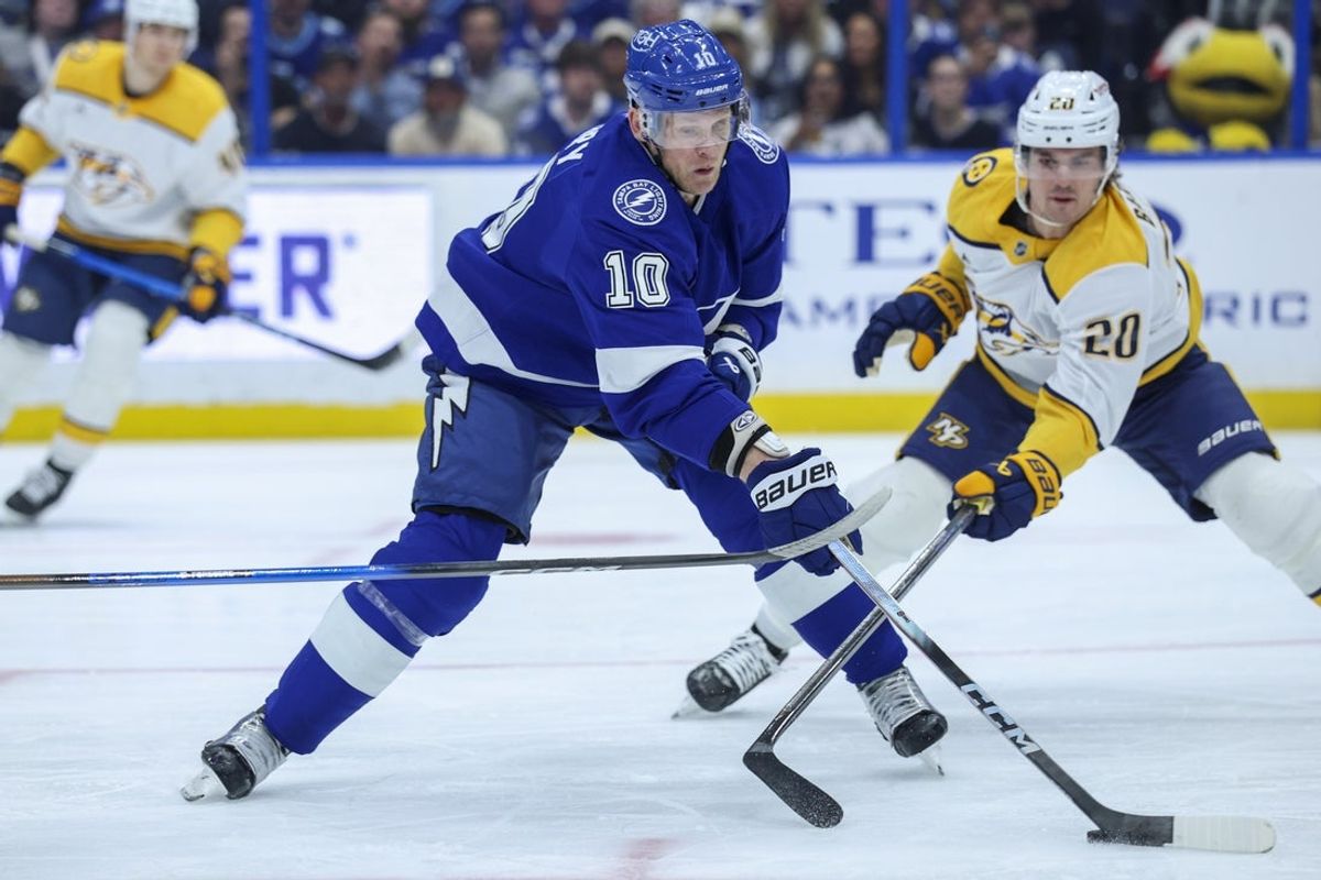 Mar 29, 2026; Tampa, Florida, USA; Tampa Bay Lightning right wing Corey Perry (10) controls the puck against the Nashville Predators in the second quarter at Benchmark International Arena. Mandatory Credit: Nathan Ray Seebeck-Imagn Images