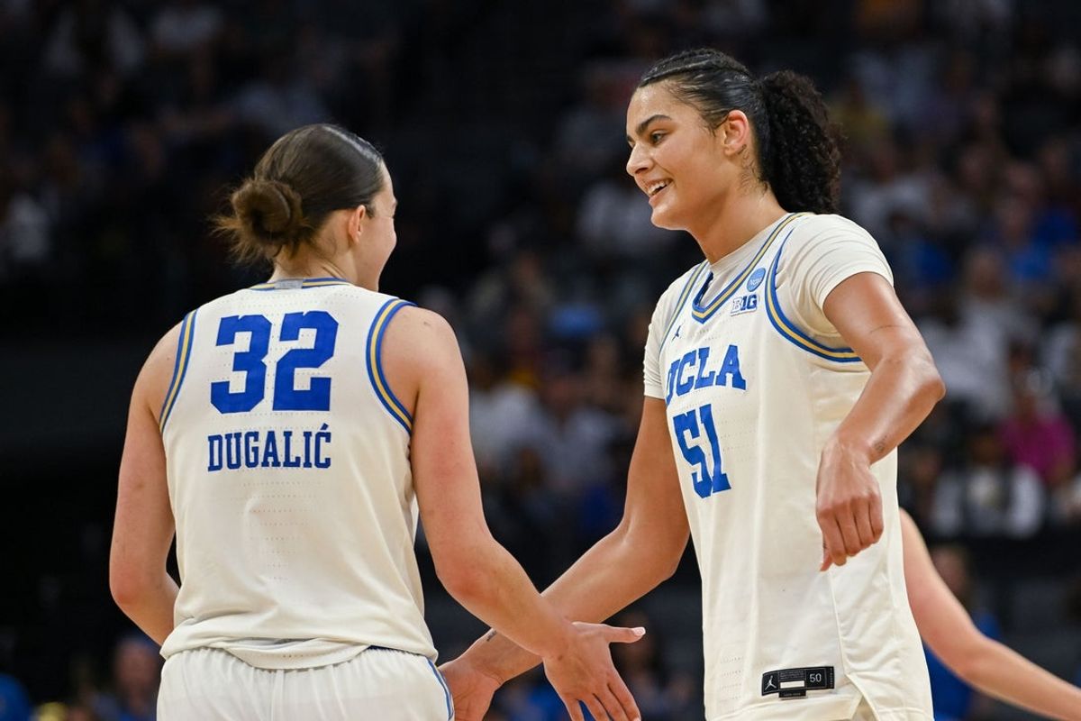 Mar 29, 2026; Sacramento, CA, USA; UCLA Bruins forward Angela Dugalic (32) and center Lauren Betts (51) celebrate after defeating the Duke Blue Devils in an Elite Eight game in the Sacramento Regional 4 of the women's 2026 NCAA Tournament at the Golden 1 Center. Mandatory Credit: Ed Szczepanski-Imagn Images