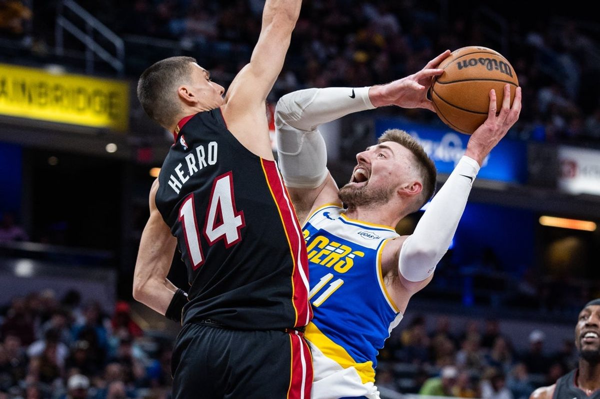 Mar 29, 2026; Indianapolis, Indiana, USA; Indiana Pacers center Micah Potter (11) shoots the ball while Miami Heat guard Tyler Herro (14) defends in the first half at Gainbridge Fieldhouse. Mandatory Credit: Trevor Ruszkowski-Imagn Images