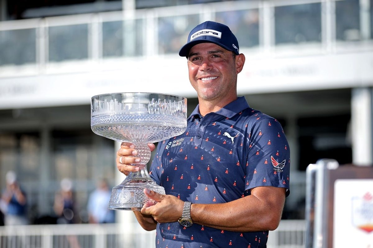 Mar 29, 2026; Houston, Texas, USA; Gary Woodland holds up the championship trophy after winning the Texas Children's Houston Open golf tournament. Mandatory Credit: Erik Williams-Imagn Images
