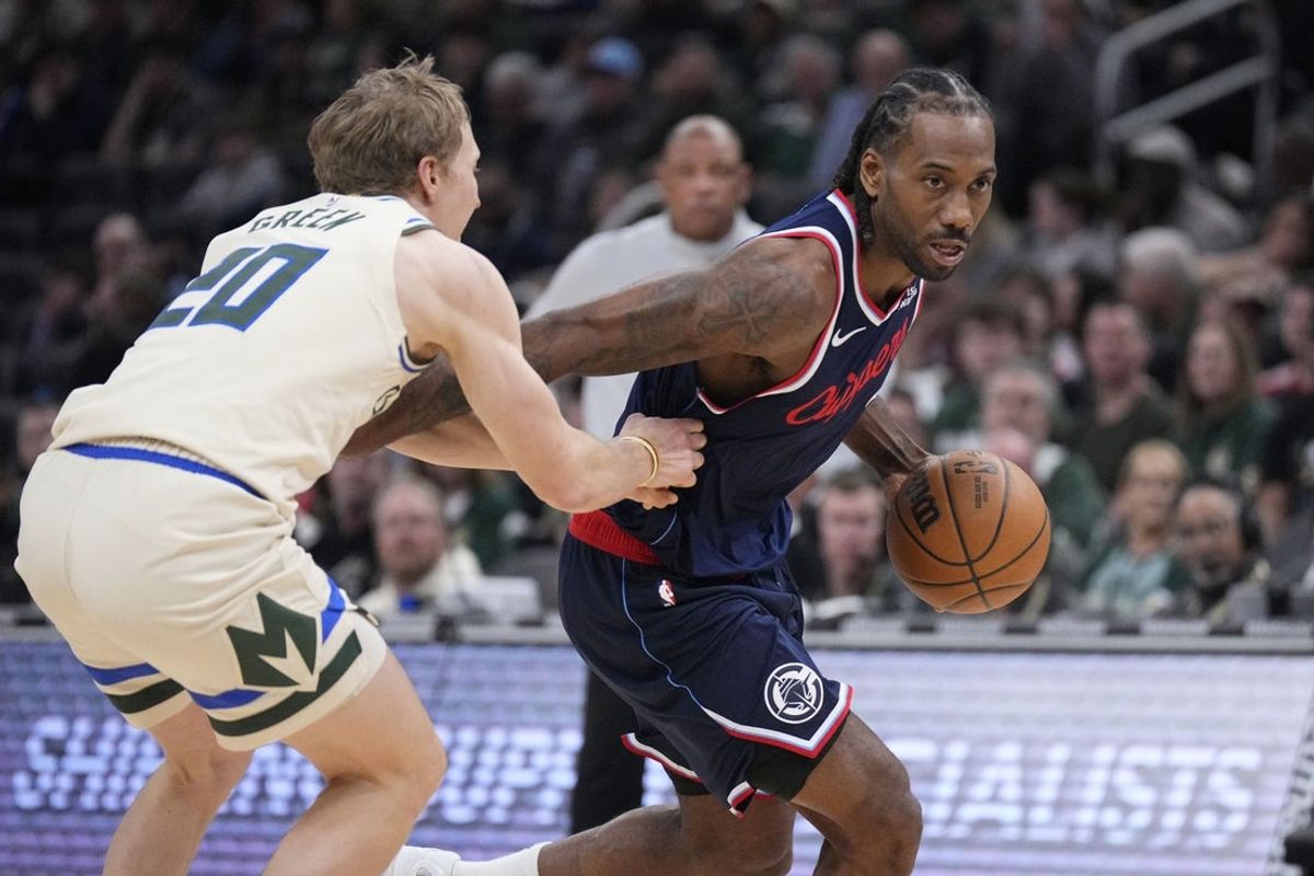 Mar 29, 2026; Milwaukee, Wisconsin, USA; LA Clippers forward Kawhi Leonard (2) drives against Milwaukee Bucks guard AJ Green (20) in the first half at Fiserv Forum. Mandatory Credit: Michael McLoone-Imagn Images