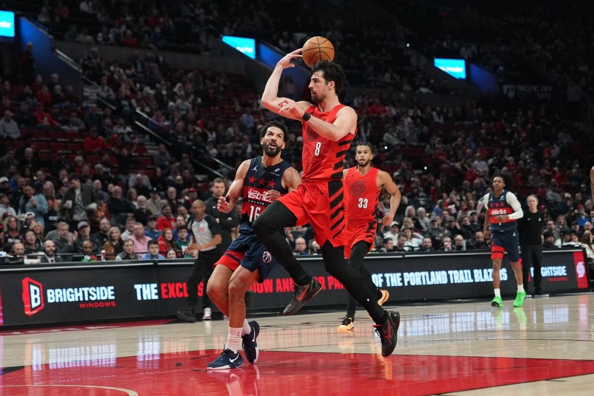 Mar 29, 2026; Portland, Oregon, USA; Portland Trail Blazers forward Deni Avdija (8) passes the ball to Toumani Camara (33) as Washington Wizards forward Anthony Gill (16) defends during the first half at Moda Center. Mandatory Credit: Soobum Im-Imagn Images