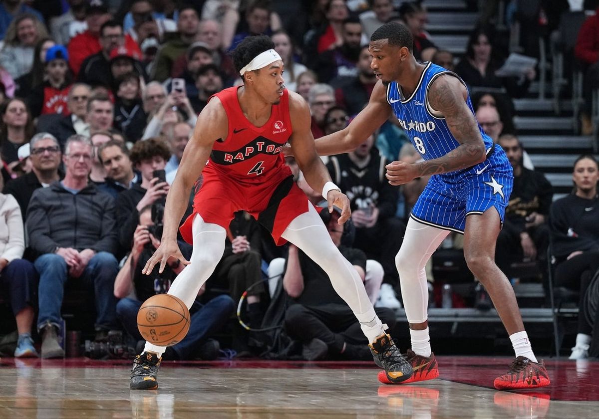 Mar 29, 2026; Toronto, Ontario, CAN; Toronto Raptors forward Scottie Barnes (4) controls the ball as Orlando Magic forward Jamal Cain (8) tries to defend during the first quarter at Scotiabank Arena. Mandatory Credit: Nick Turchiaro-Imagn Images